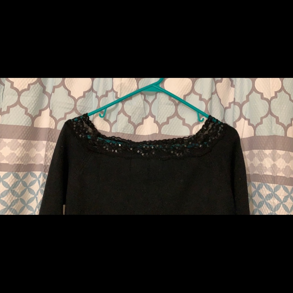 Long sleeve beaded around shoulders.